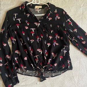 Love Notes mushroom long sleeve collared bottom wrap top.